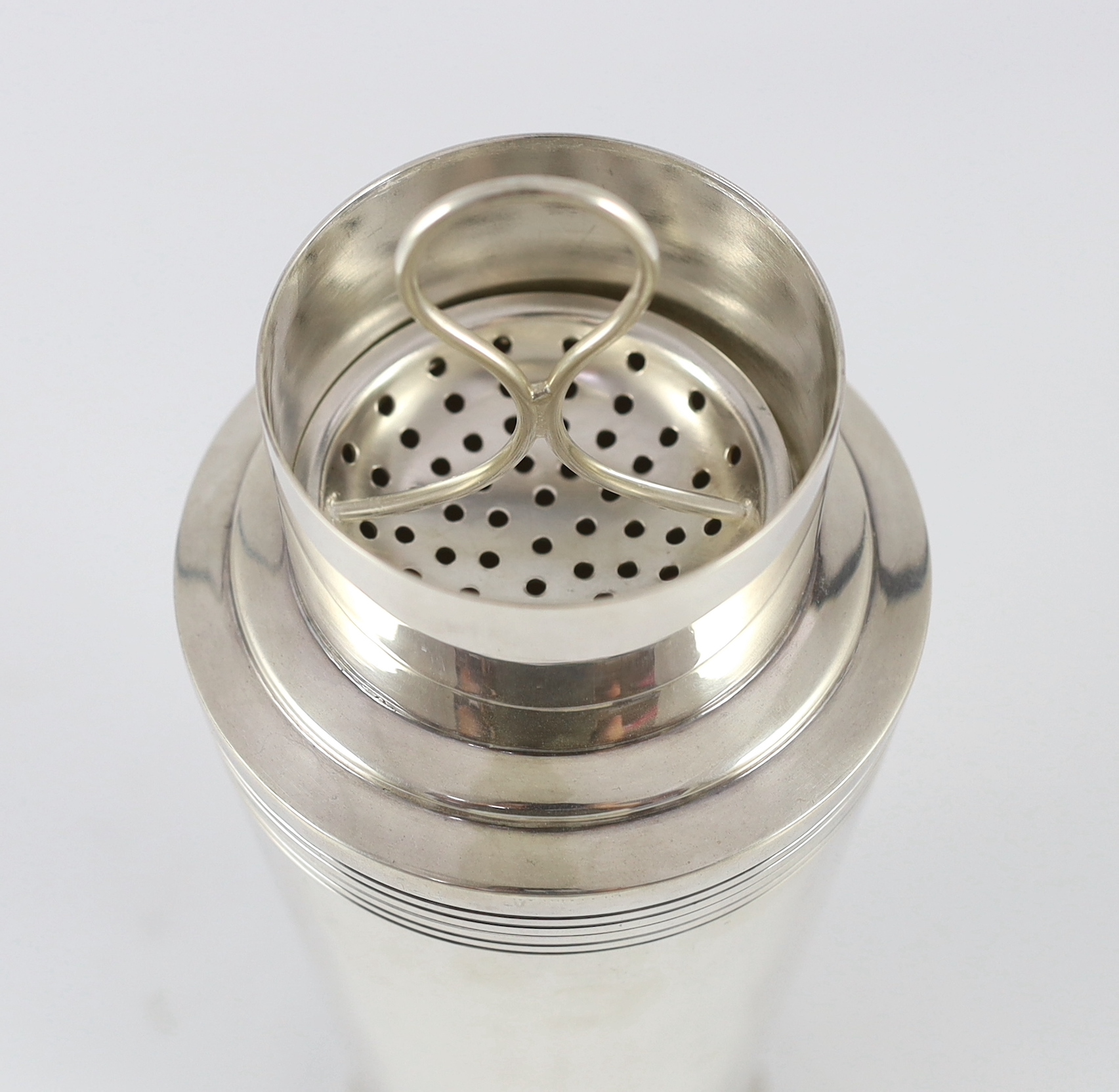 A 1930's Art Deco Mappin & Webb silver plated cocktail shaker designed by Keith Murray, numbered W28721